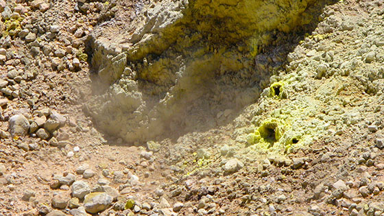  Fumaroles constantly hissing 
 Sulfur crystal holes pouring out steam and sulfur gas